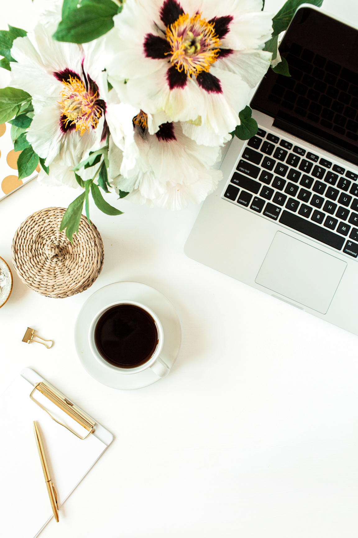 Laptop, Coffee, Stationery and Flowers on White Background